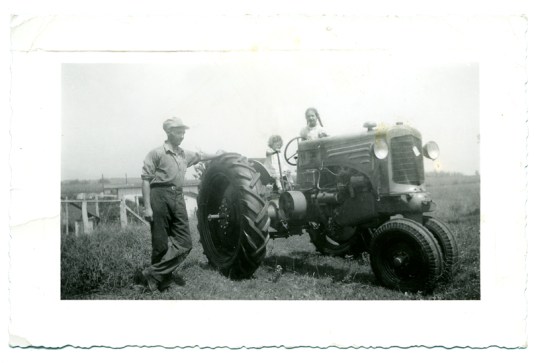 Brand new tractor with tiny sister Jean and me behind the wheel