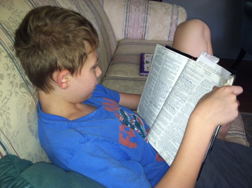 Patrick reading in Book of Luke