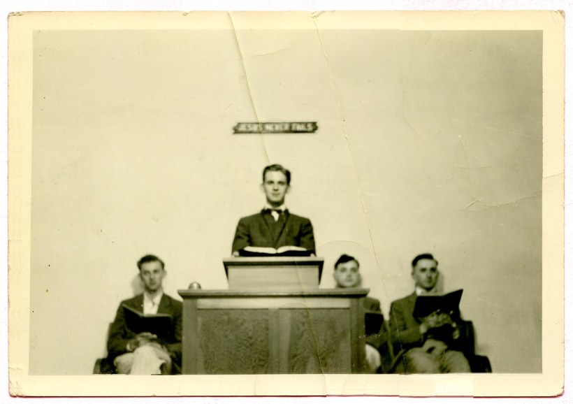 Richard Sauder in pulpit, to the right Parke Garber, extreme right Ray Longenecker, my father  (Unidentified man at left)