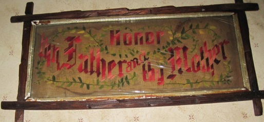 Framed needlework above one of the kitchen doors in Grandma Longenecker's house