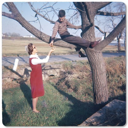 Mark handing walnuts to his sister Janice, 1964