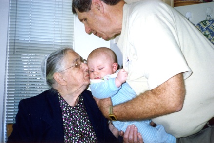 Mother kissing her great grandson Patrick, held by Grandpa Cliff