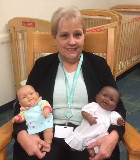 Friend and co-worker Gloria, who'd rather hold real babies!